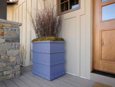 Create stylish planters, complete with bolt head trim, to flank and define your front door.