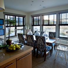 Open Kitchen and Dining Area Near Large Windows