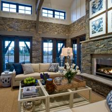 Country Styled Great Room With Limestone Walls and Fireplace