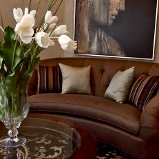 Elegant Living Room With Brown Tufted Sofa
