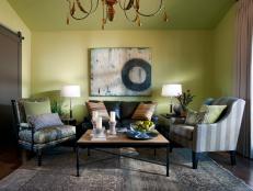 Green Living Area With Gray Armchairs and Eclectic Accessories