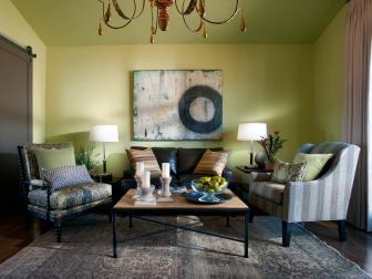 Green Living Area With Gray Armchairs and Eclectic Accessories