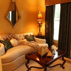 Gold Living Room With Unusual Teardrop Mirror