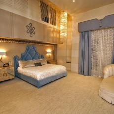 Luxurious Master Bedroom With Crystal Chandelier and Blue Bed