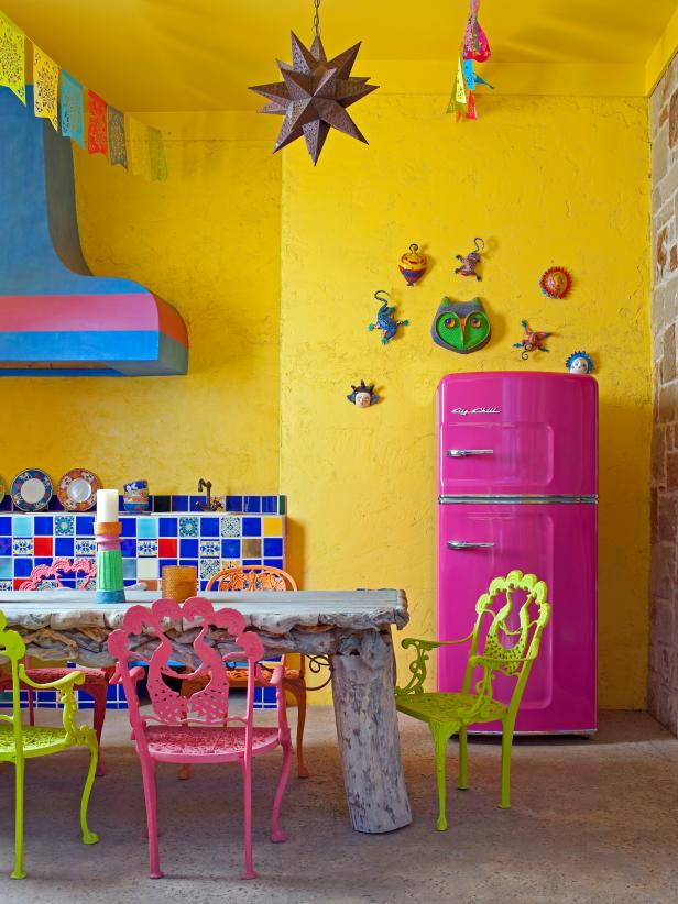 Spanish-Style Kitchen With Vibrant Tile and Hood