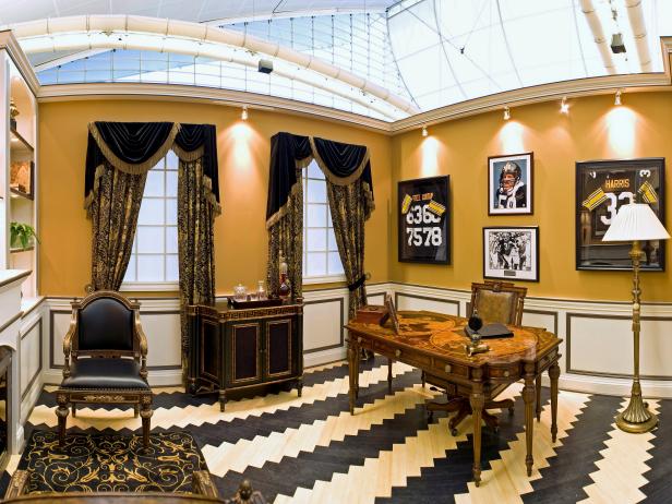 Black and Gold Home Office With Wood Desk and Black Velvet Drapes