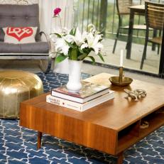 Chic Living Room With Low Coffee Table and Blue Moroccan Rug