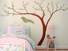 Wall decal of cherry blossoms for a small child's bedroom.