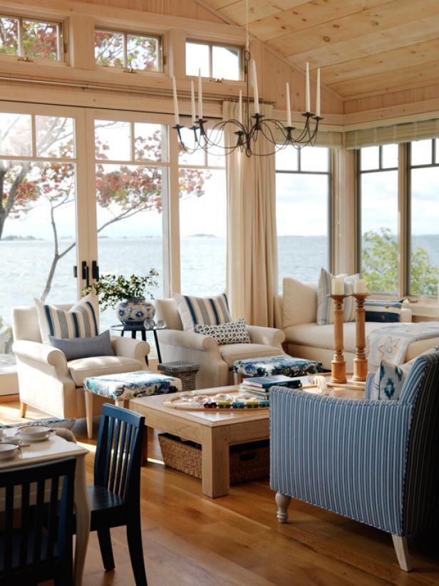 Coastal Living Room With Beadboard Ceiling And Large Windows