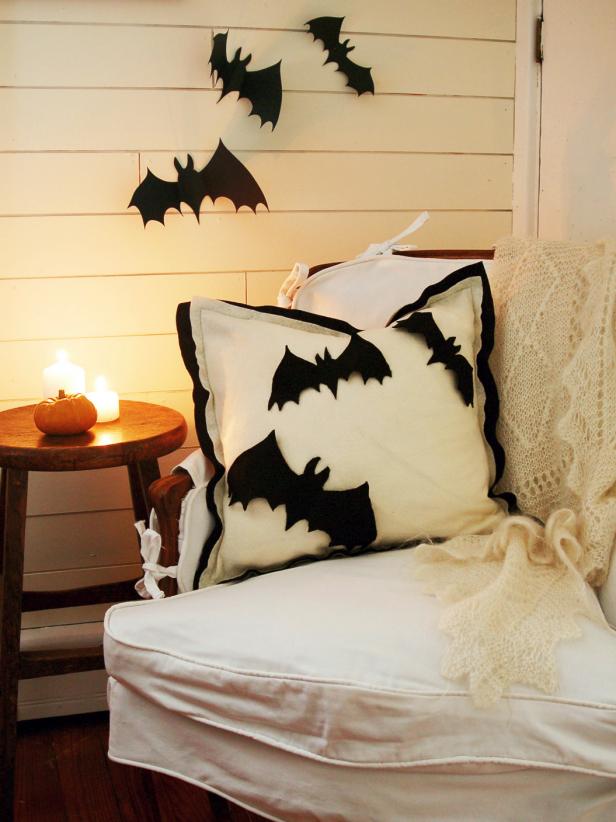 Porch Is Decorated With Halloween Applique Bat Pillows
