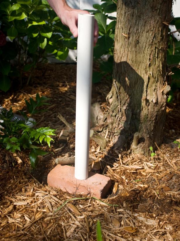 Dig a hole that is deep enough to support your bird bath. In this case, the base of the bird bath will be a repurposed bathroom sink, so the post must account for the extra weight.