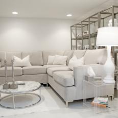 Contemporary White Living Room With Sectional Sofa And Metallic Accents