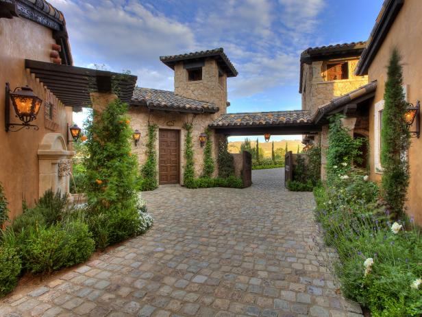 Tuscan Courtyard of Old World Home With Cobblestone Walkway