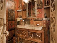 Old World Powder Room With Wallpaper, Wood Vanity and Mosaic Floor