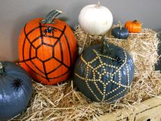 Gray, White and Orange Decorative Pumpkins on Bales of Hay