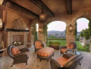 Italian Patio With Seating Area and Fireplace