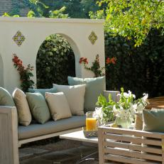 Mediterranean Neutral Outdoor Sitting Area With Spanish Arches