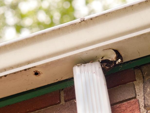 how to clean gutters: check for holes