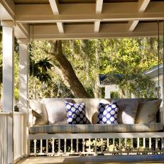Neutral Cottage Porch Swing With Patterned Pillows