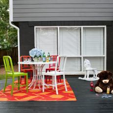 Black Deck With Red and Orange Patterned Rug