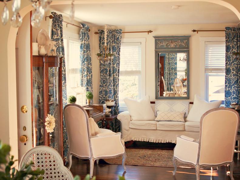 Cream French Living Room With Blue Curtains and Cream Furniture