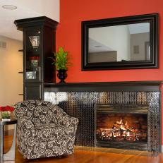 Black Mosaic Tile Fireplace on a Red Wall