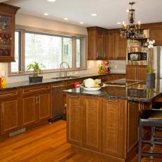 Neutral Transitional Kitchen With Granite-Topped Island