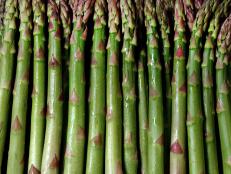 Close-up of multiple asparagus stalks.