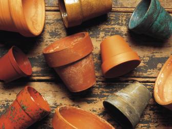 Clay Pots on Distressed Wooden Background