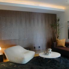 Modern Sitting Room With Wall Art and Brown and White Accents
