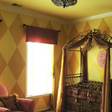 Princess Nursery With Canopy Crib and Pink Armchair