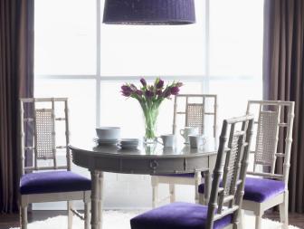 White Eclectic Dining Space With Purple Accents
