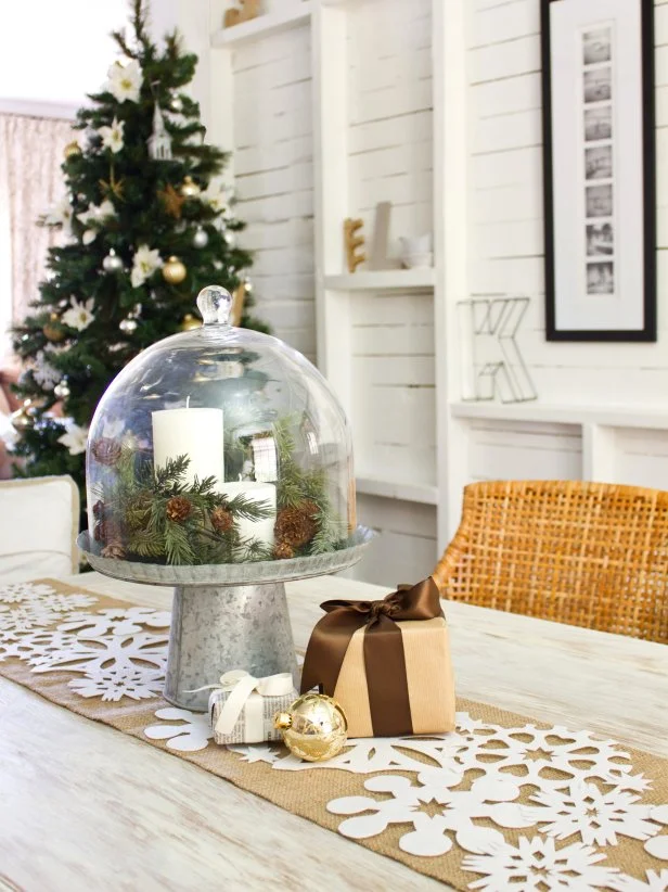 Snowflake table runner with terrarium with pine cones and candle