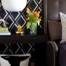 A Contemporary Side Table and Bold Wallpaper in Bedroom