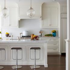 Tranquil White Kitchen With Polish Nickel Bar Stools