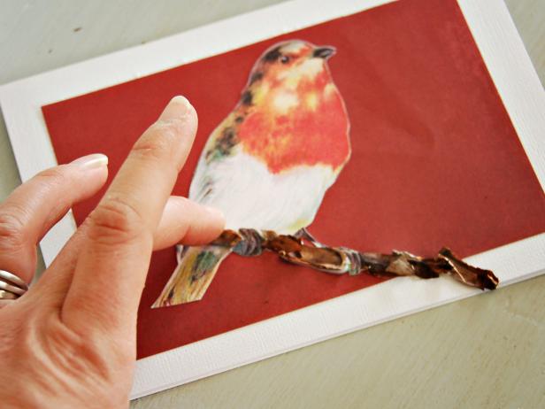 To bring your holiday card to life add a perch for your bird to sit on made from real pinecone.  Break of some of the scales from the pincone, add wrinkel-free craft glue to the card where you want to adhere the branch and simply place the scales on the glue.
