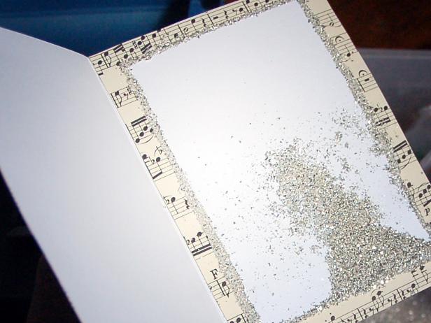 To get a glitter boarder, run a thin line of glue around the edges.  Cover with glitter and shake off any excess.  Then voila, you have a sparkling, handmade, one of a kind Christmas card!
