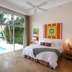 Master Bedroom with Colorful Art and Full Length Window