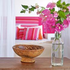 Contemporary Bedroom With Pink Flowers and Hand-Carved Bowl