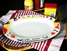 Surprise the grill king in your home with a hand-painted ceramic platter that's a fun and easy project for kids, Dad will be proud to serve perfectly cooked burgers on this custom Father's Day gift.