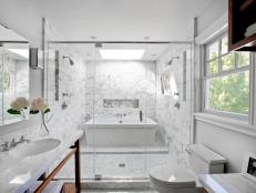 White Bathroom With Double Shower and Freestanding Tub