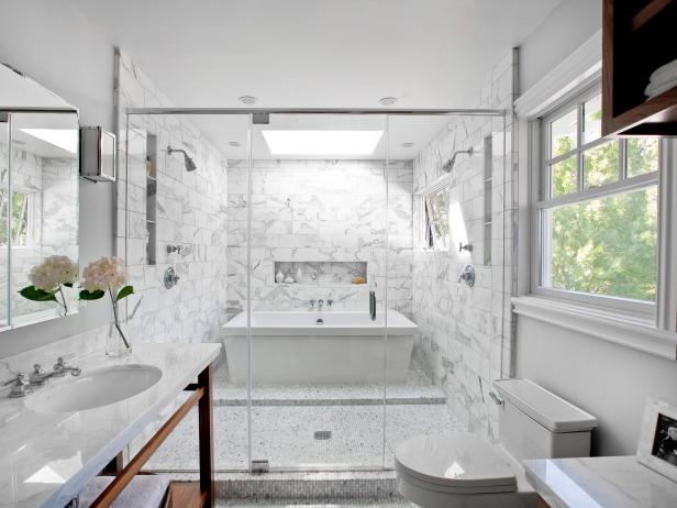 Interior Of A Luxury Bathroom With Stand Up Shower And Tub Stock