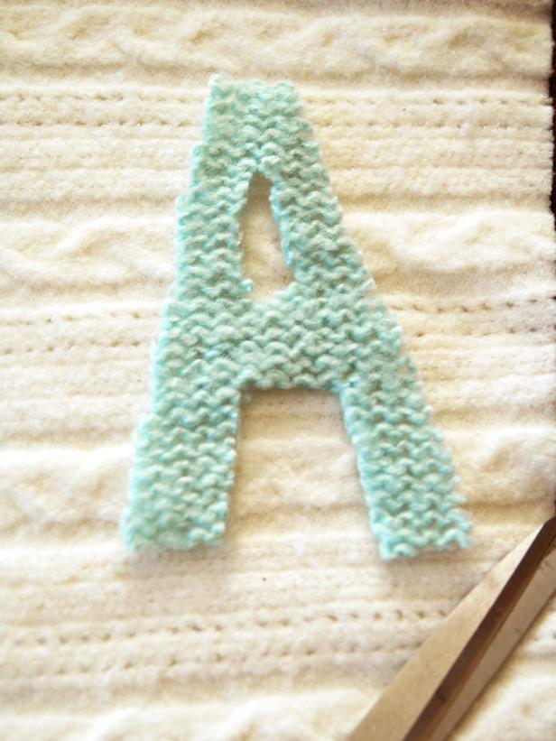 Personalize your no-knit Christmas sweater stocking with monogramming from another old sweater you want to recycle.