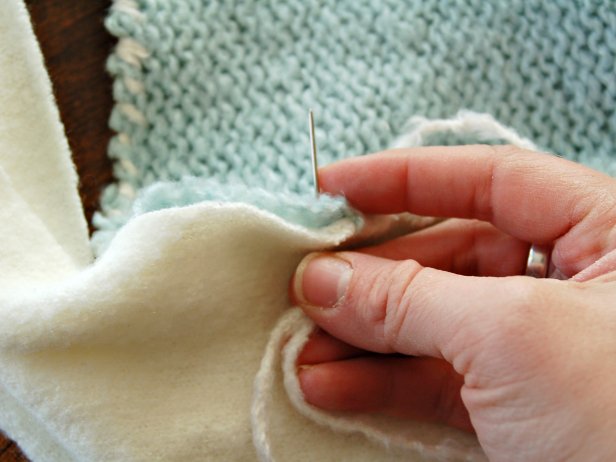 To create a cuff, line up the raw edge of cuff with top of stocking. Stitch together so seam is showing on outside of the stocking