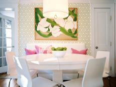 Dining Room With Floral Painting, White Table, Green Wallpaper