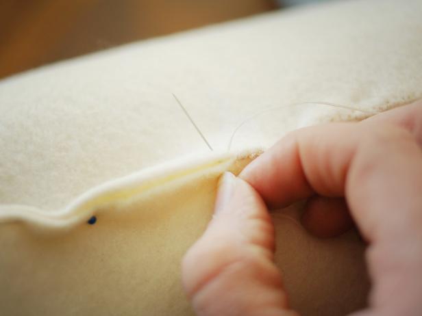 Use coordinating all-purpose thread and a needle to sew closed using a whip stitch.