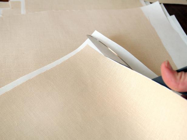 Trim any overhanging freezer paper or fabric, if necessary. Repeat with 12 other pieces of linen and paper.