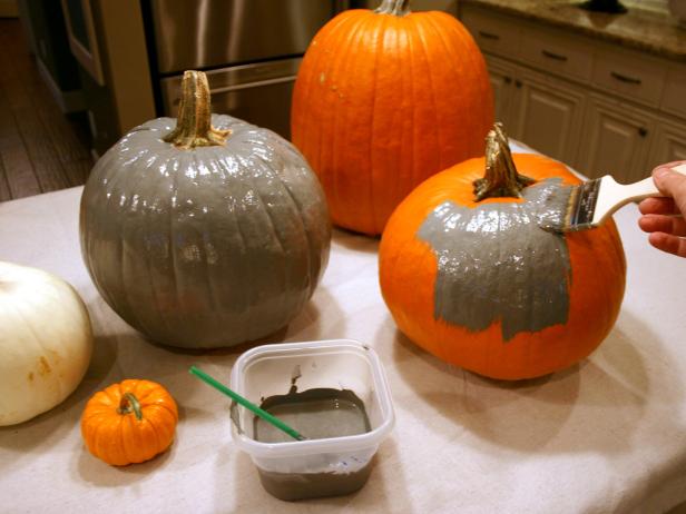 Brush a layer of paint onto selected pumpkins and allow to dry for approximately 30 minutes.