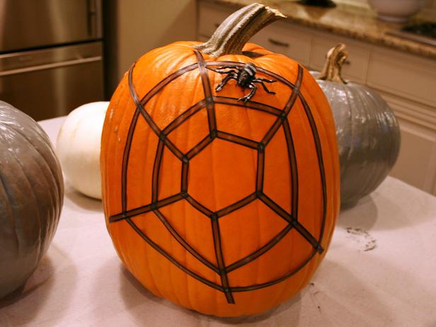 Place a spider on the top of your pumpkin to add the final decorative touch.