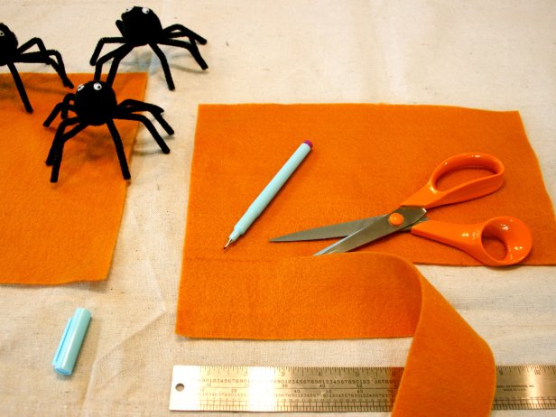 Cut strips of orange fabric to make Halloween napkin rings.